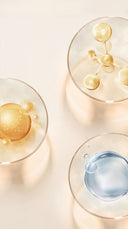 Luxury skincare serums and active molecules in petri dishes highlighting hydration, protection, and calming benefits with Audrose® for sensitive skin.